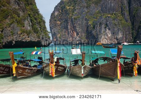 KO PHI PHI LEH, THAILAND, February 1, 2014: Overcrowded beach of Maya Bay, Andaman Sea, famous tourist destination in the Ko Phi Phi achipelago