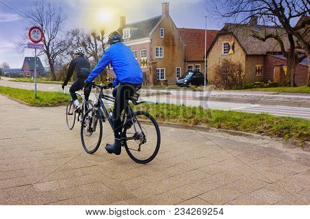 Cyclist Riding Mountain Bike . Romantic Couple Cycling Together . Healthy Lifestyle