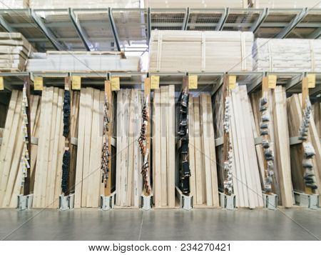 Abstract Blurred Hardware Store Shelves With Wooden Boards As Background
