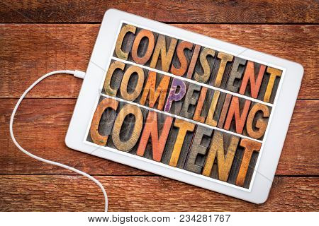 consistent, compelling content -  recommendation for bloging and social media marketing - a word abstract in vintage letterpress wood type on a digital tablet against rustic wood