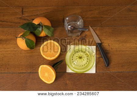 Make A Juice Of Oranges On A Wooden Table