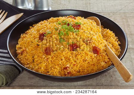 Couscous With Tomato - A Bowl Of Couscous Flavoured With Sun Dried Tomato Pesto.