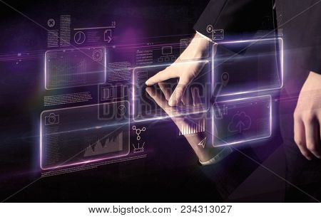Male hands touching interactive table with purple cloudspace graphic on it 