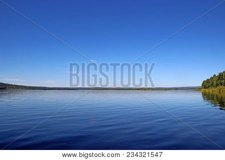 Amazing Blue Sky Over The Surface Of The Wide River
