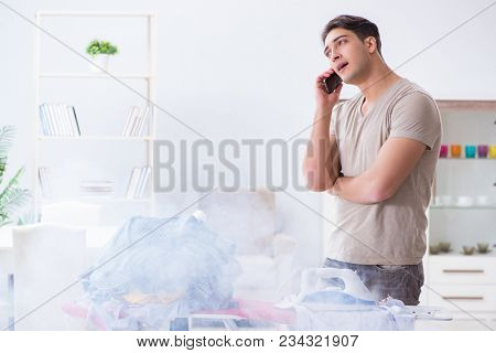 Inattentive husband burning clothing while ironing