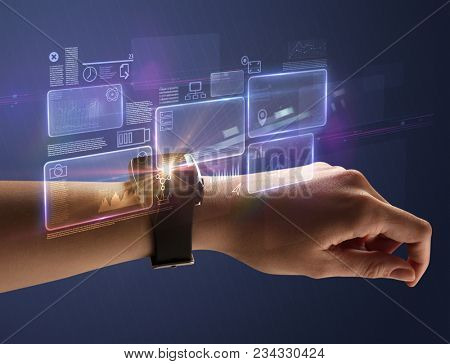 Female hand wearing smartwatch with statement labels around and dark background