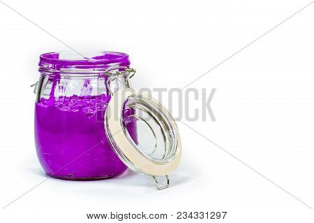 purple color of plastisol ink in white background fill in transparent bottle.plastisol ink is specia