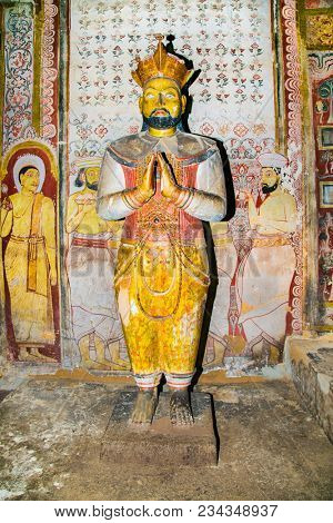 DAMBULLA SRI LANKA - DEC 27, 2016: Ancient king statues inside Dambulla Cave Temple. Cave Temple is a World Heritage Site near Dambulla city on Dec 27, 2016. Sri Lanka.