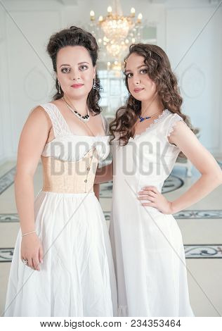 Two Beautiful Women In Old-fashioned Negligee