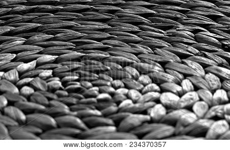Round Straw Mat Texture With Blur Effect In Black And White. Abstract Background And Texture For Des