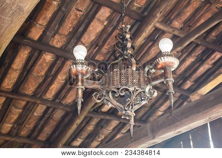 Antique Brass Chandelier In An Outdoor Kitchen In The Andes Mountains Of Ecuador
