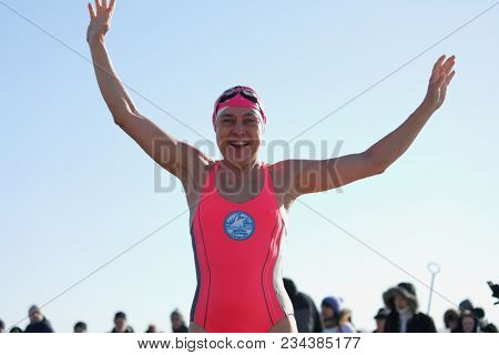 ST. PETERSBURG, RUSSIA - MARCH 4, 2018: Head of club Winter Swimmers of Capital City Natalia Seraya participates in winter swimming competitions for Big Neva Cup