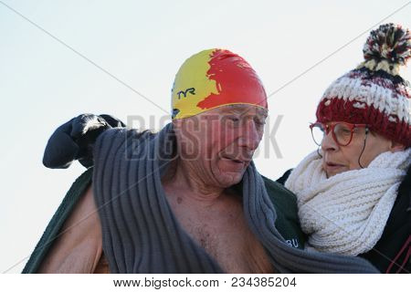 ST. PETERSBURG, RUSSIA - MARCH 4, 2018: 80 years old Richard Buche from Belgium after winter swimming competitions for Big Neva Cup. Winter swimmers from 12 countries take part in the competitions