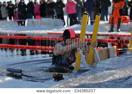 ST. PETERSBURG, RUSSIA - MARCH 4, 2018: Winter swimming competitions for Big Neva Cup. Winter swimmers from 12 countries aged from 12 to 78 take part in the competitions this year