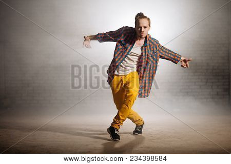 Manful Guy With Fashionable Clothers Dancing On Foggy Weather On The Street. Presenting Skills.