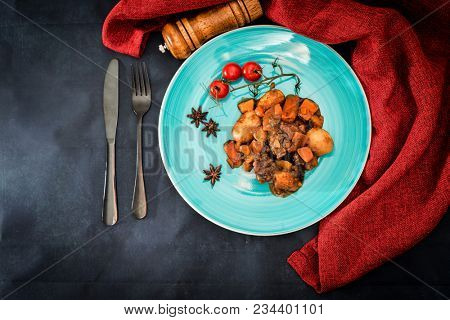 Beef meat stewed with potatoes-Traditional French cuisine Beef Bourguignon potatoes carrots in persillade