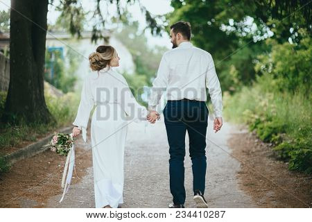 Happy Newlywed Couple On A Walk In Old European Town Street, Gorgeous Bride In White Wedding Dress T
