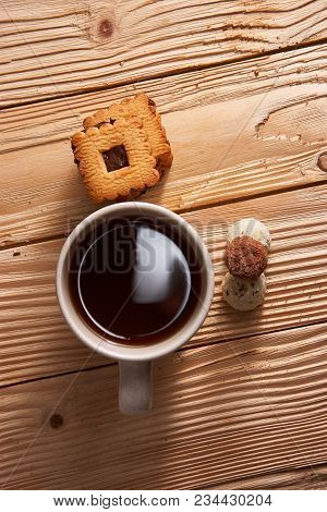 Cup Of Tea With Tasty Cookies On Wooden Background