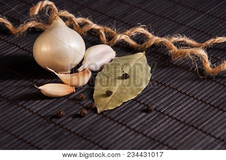 Garlic, Onion, Bay Leaf, Black Pepper On Black Table. Garlics. Sliced Garlic, Garlic Clove Garlic Bu