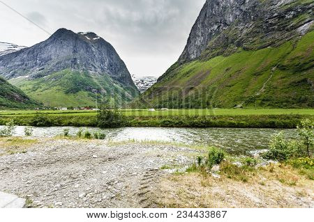 Tourism Vacation And Travel. Mountains Landscape At Summer With Beautiful Grren Valley, Stryn Munici