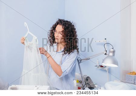 Dressmaker Measuring Nightgown At Workplace. Ready Order. Improving Sewing. Small Business