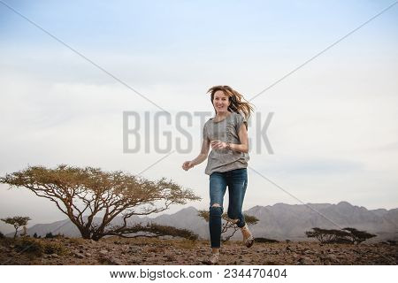 Girl Have Fun In Desert In A Summer Day