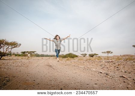 Girl Have Fun In Desert In A Summer Day