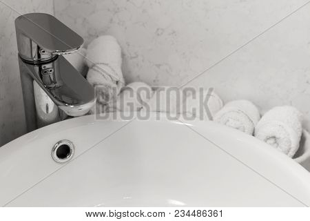 Bathroom Interior With Stylish White Sink. Face Towels Near The Washbasin