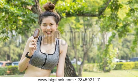 Asian Cute Sport Healthy Fit And Firm Slim Teen Girl Eat Ice Cream In Summer Day At Outdoor Garden P