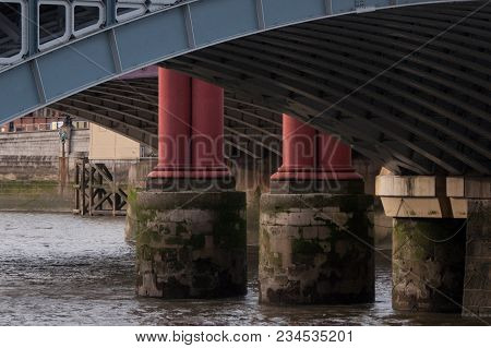 A View Of The Arch Of A Bridge Over The River Thames Showing The Construction.
