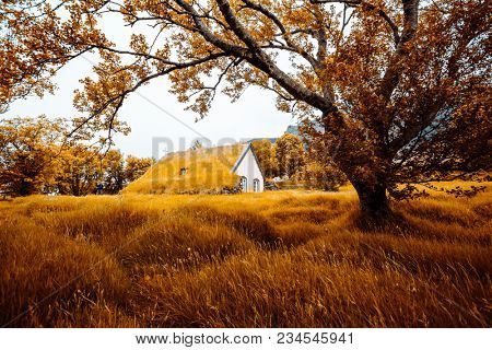 Amazing view of turf church Hofskirkja. Location place of Iceland, small village Hof, Europe. Scenic image of beautiful nature landscape. Attractive summer scene. Discover the beauty of earth.