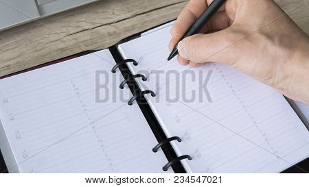Man Is Going To Write Something On His Notebook. Top View, Flat Lay. In Search Of Inspiration. A Man
