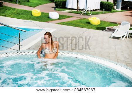 Beautiful Woman In Outdoor Hydromassage Tube