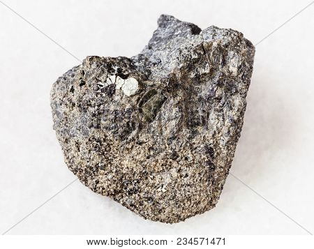 Macro Shooting Of Natural Mineral Rock Specimen - Raw Peridotite Stone With Phlogopite Mica On White