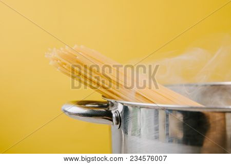 Spaghetti Boiling In Stewpot Isolated On Yellow
