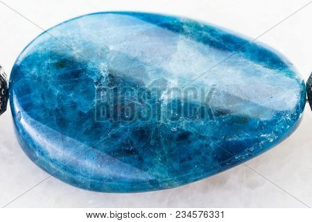 Macro Shooting Of Natural Mineral Rock Specimen - Cabochon From Polished Kyanite Gemstone On White M