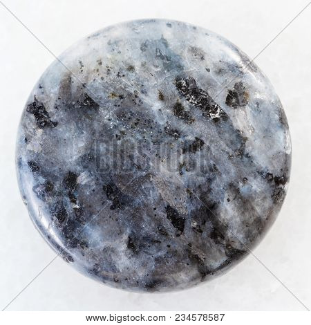 Macro Shooting Of Natural Mineral Rock Specimen - Cabochon From Gray Labradorite Gemstone On White M