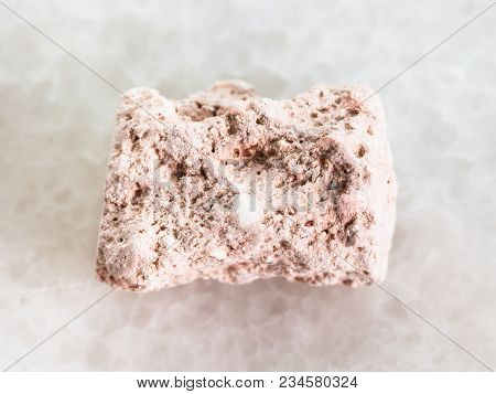 Macro Shooting Of Natural Mineral Rock Specimen - Rough Kaolinite Stone On White Marble Background