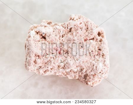 Macro Shooting Of Natural Mineral Rock Specimen - Raw Kaolinite Stone On White Marble Background