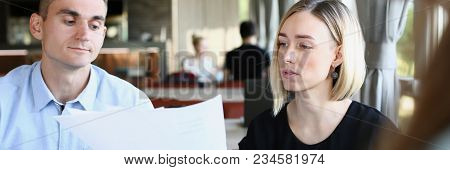 Businessmen Stady Documents In Cafe. Discuss Chart Report