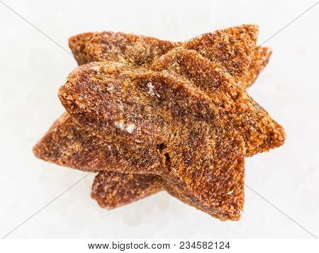 Macro Shooting Of Natural Mineral Rock Specimen - Rough Glendonite Stone On White Marble Background 