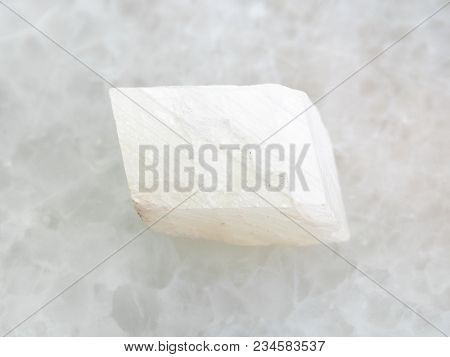 Macro Shooting Of Natural Mineral Rock Specimen - Rough White Calcite Stone On White Marble Backgrou