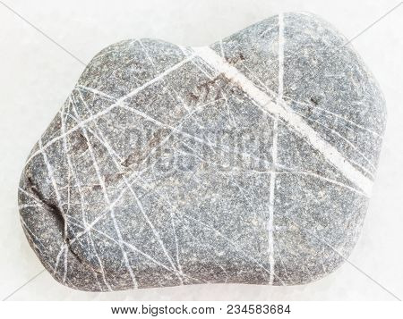 Macro Shooting Of Natural Mineral Rock Specimen - Greywacke Sandstone On White Marble Background