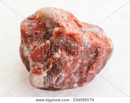 Macro Shooting Of Natural Mineral Rock Specimen - Pegmatite Stone On White Marble Background