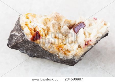 Macro Shooting Of Natural Mineral Rock Specimen - Red Crystal Of Cinnabar In Rough Carbonatite Stone