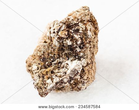 Macro Shooting Of Natural Mineral Rock Specimen - Brown Astrophyllite Crystals In Raw Natrolite Ston