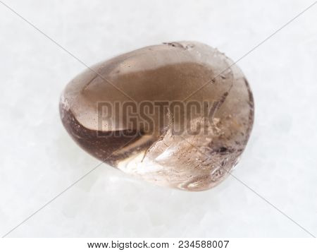 Macro Shooting Of Natural Mineral Rock Specimen - Polished Smoky Quartz Gemstone On White Marble Bac