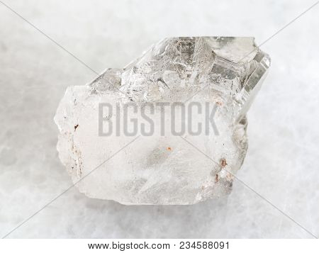 Macro Shooting Of Natural Mineral Rock Specimen - Rough Rock-crystal Of Quartz Gemstone On White Mar