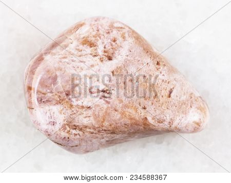 Macro Shooting Of Natural Mineral Rock Specimen - Polished Ussingite Gemstone On White Marble Backgr