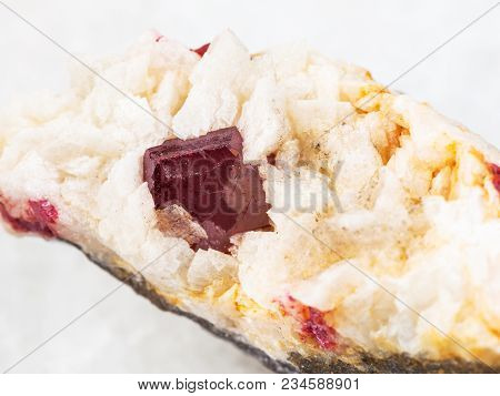 Macro Shooting Of Natural Mineral Rock Specimen - Red Crystal Of Cinnabar Close Up In Rough Carbonat